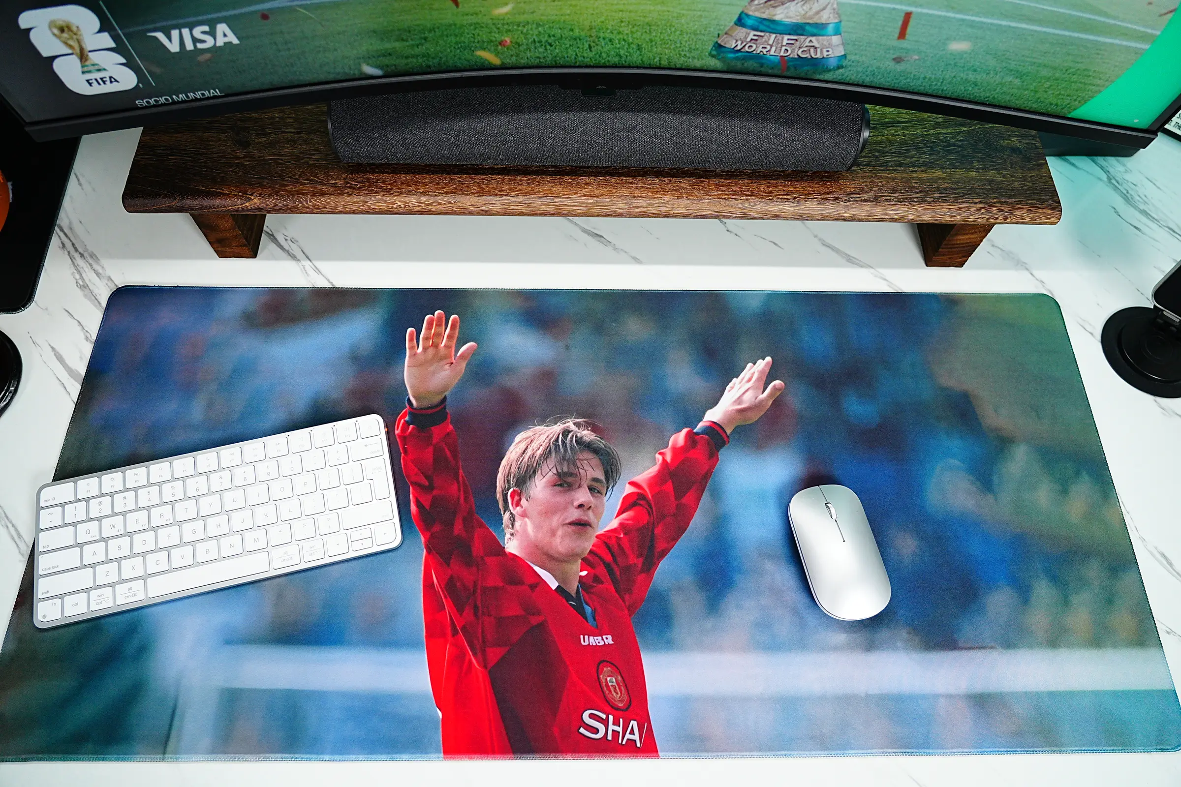 Soccer Mouse Pads shown in a Beckham football desk setup with keyboard, mouse, World Cup screen, and classic soccer artwork.