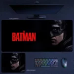 Batman Desk Mat with a dark movie poster portrait, masked stare, and red title design for a cinematic desktop setup