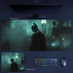 Batman Desk Mat with a rainy Gotham scene, misty skyline, and a watchful vigilante standing in the night