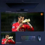 Cristiano Ronaldo mouse pad showing him in a Manchester United jersey holding and kissing a golden boot trophy, displayed in two pad sizes