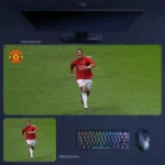Cristiano Ronaldo mouse pad featuring a Manchester United on-pitch running action scene on a green football field, shown in desk mat and mouse pad sizes