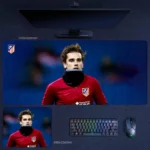 Antoine Griezmann Atletico Madrid Mouse Pad showing a focused portrait in red training wear on a deep blue background