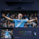 Haaland Arms Wide Desk Mat featuring Haaland’s open-arm celebration and commanding presence in Manchester City blue