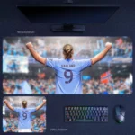 Haaland No 9 Victory Desk Mat featuring Haaland’s raised-arm back view in Manchester City blue with his number 9 shirt