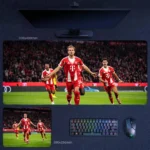 Harry Kane Bayern Goal Celebration Desk Mat featuring Kane with arms outstretched as Bayern teammates race in behind him