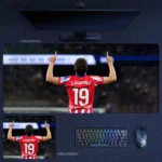Julian Alvarez Atletico Madrid Desk Mat showing Alvarez from the back with number 19 and raised-arm celebration in Atletico colors