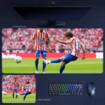 Julian Alvarez Atletico Madrid Desk Mat showing Alvarez striking the ball during a live Atletico Madrid match