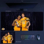 Kobe Bryant Lakers Championship Duo Desk Mat showing Kobe and Pau Gasol holding NBA title trophies in a gold-and-purple collector setup