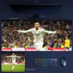 Kylian Mbappe Real Madrid Mouse Pad showing Mbappe racing forward with arms outstretched after a decisive goal in Madrid white