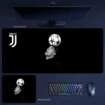 Cristiano Ronaldo desk mat featuring a black and white football skill pose with ball balance artwork and Juventus-inspired styling