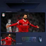 Mohamed Salah Liverpool Desk Mat with Salah in a red graphic celebration design, shown in extended and compact desk mat sizes