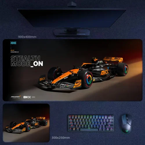 Lando Norris 2025 stealth mode desk mat with black and papaya McLaren F1 artwork, sharp front angle, and championship-era attitude