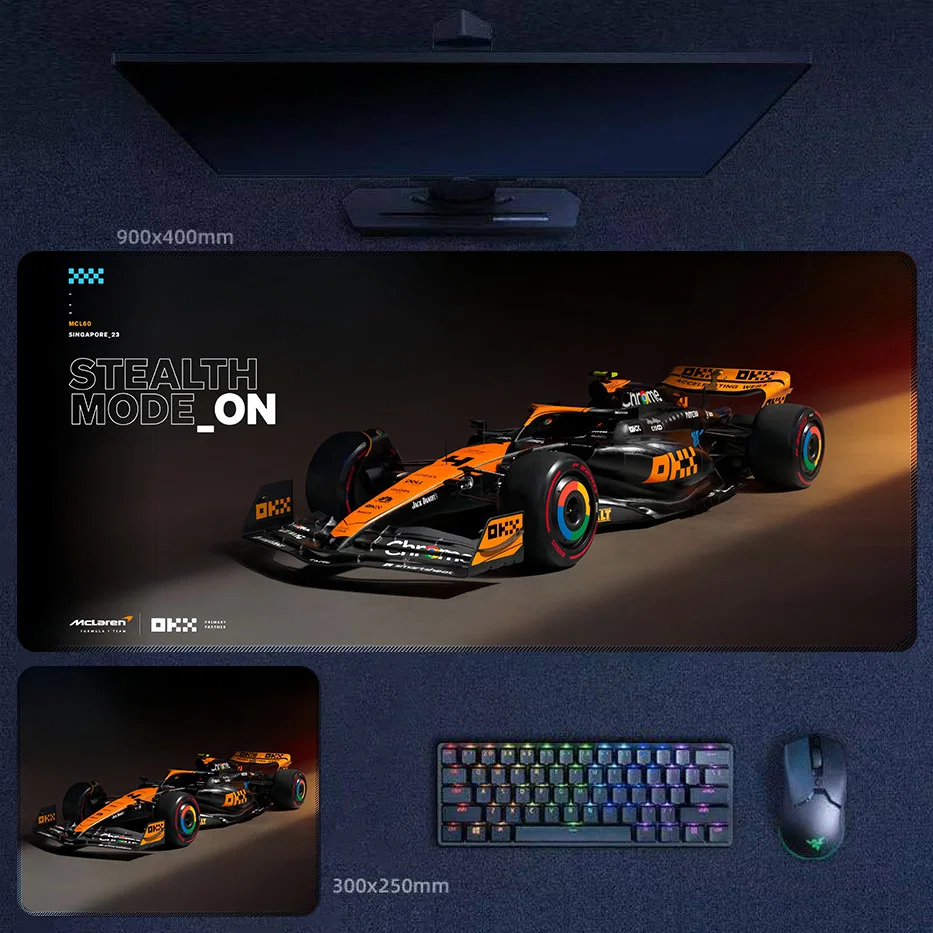 Lando Norris 2025 stealth mode desk mat with black and papaya McLaren F1 artwork, sharp front angle, and championship-era attitude