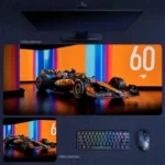 Lando Norris 2025 No 60 desk mat with McLaren F1 artwork, neon studio backdrop, bold driver number display, and collector-style setup appeal