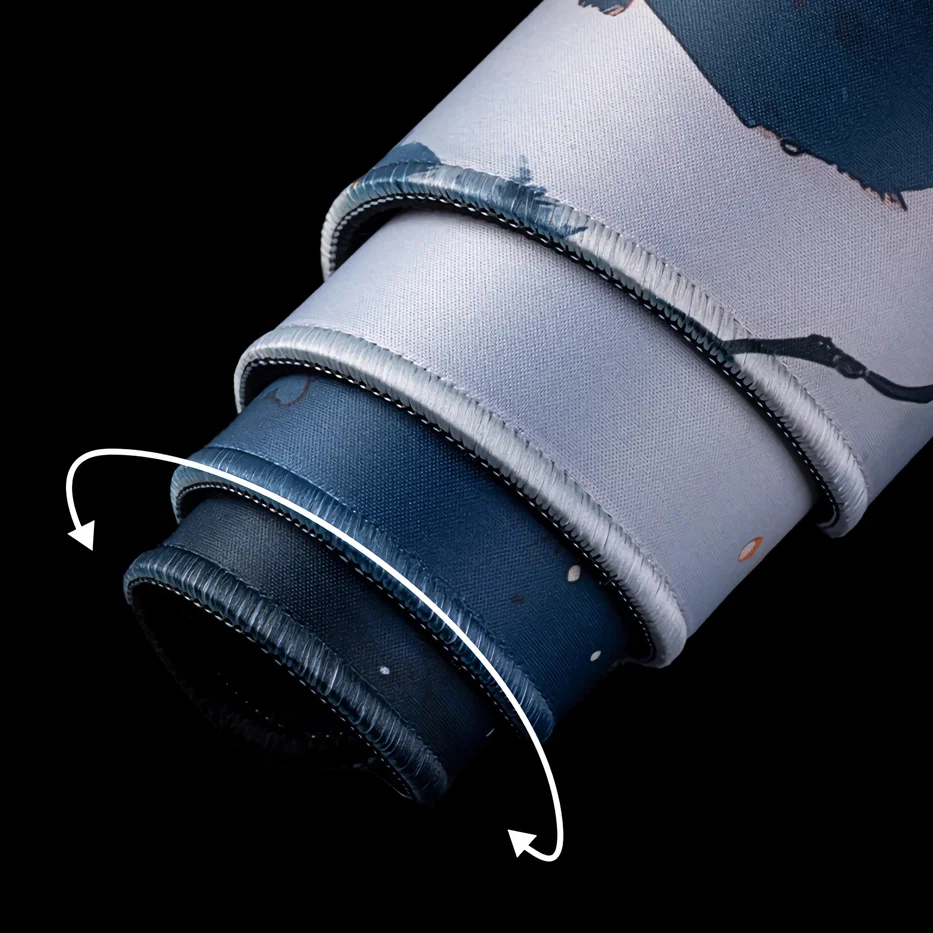 Rolled AiryPad flexible desk mat showing a bendable mat with stitched edges, made to stay flexible and resist cracking over time