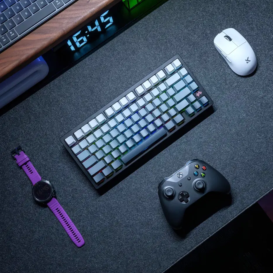 Close-up desk mat scene with mechanical keyboard, gaming controller, and mouse on an AiryPad mouse pad.