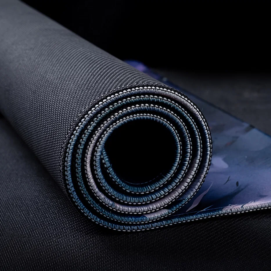 Rolled AiryPad stitched edge desk mat showing reinforced border stitching designed to resist fraying and reduce edge curling