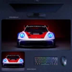 Porsche 911 GT3 desk mat with classic race colors and vivid blue headlight glow