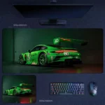 Porsche 911 GT3 desk mat with green race livery, rear wing, and illuminated taillight styling