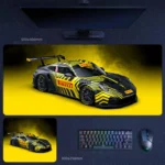Porsche 911 GT3 desk mat with black and yellow Pirelli-inspired racing livery