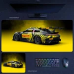Porsche 911 GT3 desk mat with black yellow livery, large rear wing, and racing detail