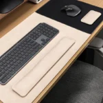 Cream executive leather desk pad wrist rest set creating a bright, minimal desk surface with a softer professional look