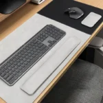 Light gray desk pad and wrist rest set for minimal office desks, with a calm neutral finish and coordinated support pieces