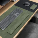 Olive green leather desk pad wrist rest set styled for a desk setup that feels calm, distinctive, and less ordinary