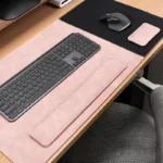 Blush pink leather desk pad and wrist rest set designed for a lighter desk style with matching keyboard and mouse support pieces