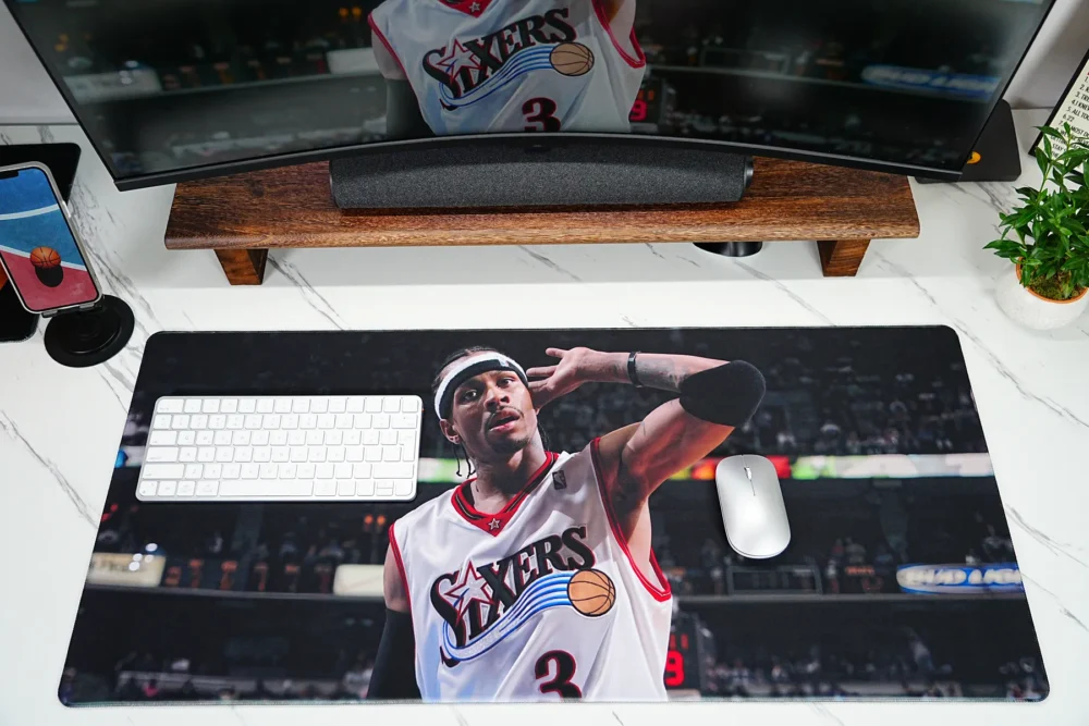 Large basketball desk mat with Allen Iverson artwork, compact keyboard, and mouse placed on the surface for daily gaming and work use