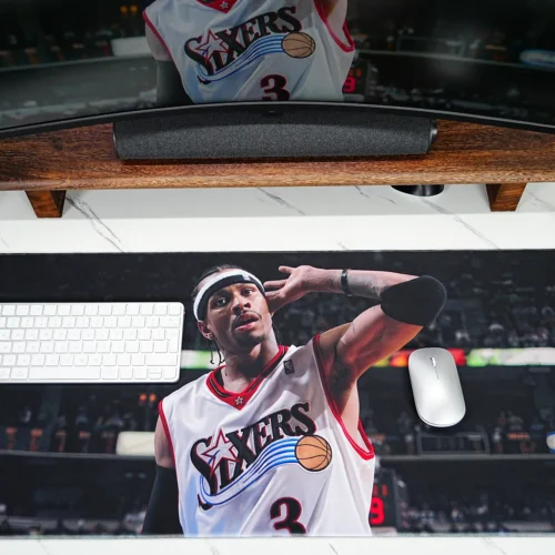 Large basketball desk mat with Allen Iverson artwork, compact keyboard, and mouse placed on the surface for daily gaming and work use