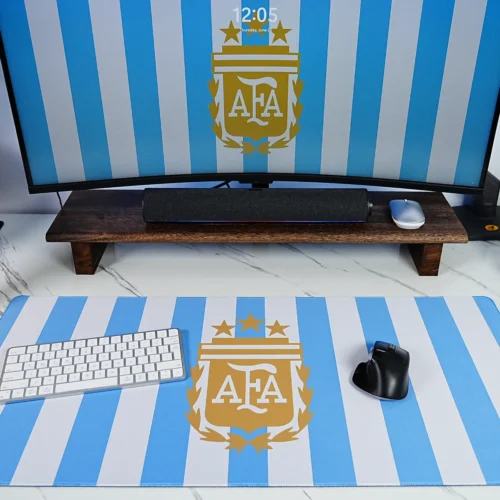 Argentina Keyboard Mouse Desk Mat Setup Argentina football desk mat used with keyboard and mouse, matching monitor wallpaper, World Cup trophy display, and visible blue-white crest artwork