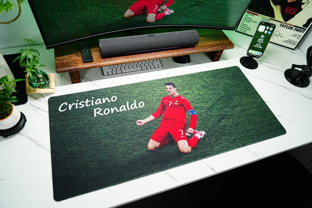 Ronaldo Desk Mat Showing Real Desktop Coverage Cristiano Ronaldo desk mat displayed on a white desktop to show real coverage for keyboard, mouse, monitor, and fan decor planning
