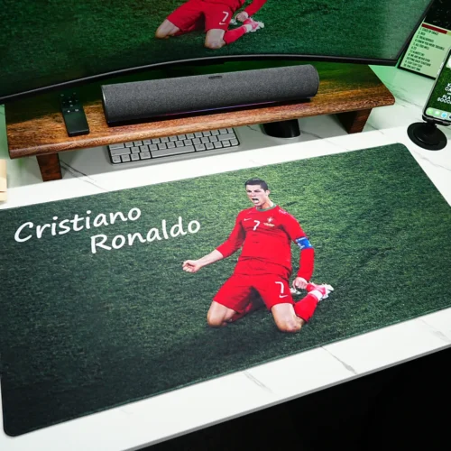 Ronaldo Desk Mat Showing Real Desktop Coverage Cristiano Ronaldo desk mat displayed on a white desktop to show real coverage for keyboard, mouse, monitor, and fan decor planning