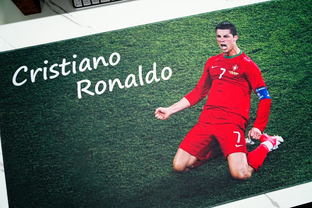 Cristiano Ronaldo Print Detail on Football Mouse Pad Close-up of Cristiano Ronaldo Mouse Pad showing clear player artwork, white name text, red kit, and grass field print detail