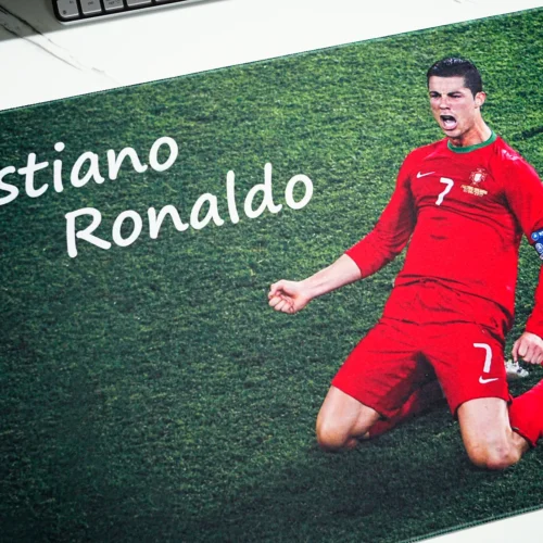 Cristiano Ronaldo Print Detail on Football Mouse Pad Close-up of Cristiano Ronaldo Mouse Pad showing clear player artwork, white name text, red kit, and grass field print detail