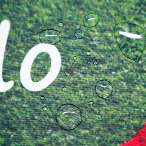 Ronaldo Mouse Pad with Spill-Resistant Fabric Water droplets sitting on Ronaldo mouse pad spill-resistant fabric, showing easier cleanup after small desk spills