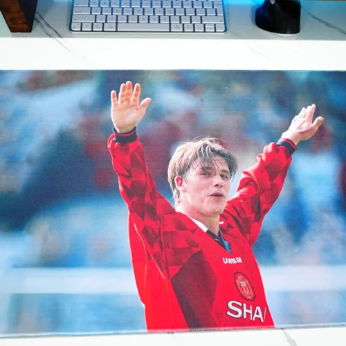 Close-up of the David Beckham tribute desk mat print, showing facial detail, raised-arm celebration, and smooth color transitions for a clear and expressive football image
