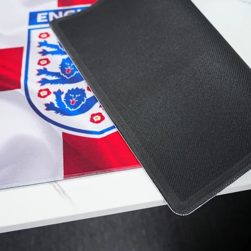 England desk mat back side showing anti-slip rubber base and stitched edge for stable placement and reduced edge fraying