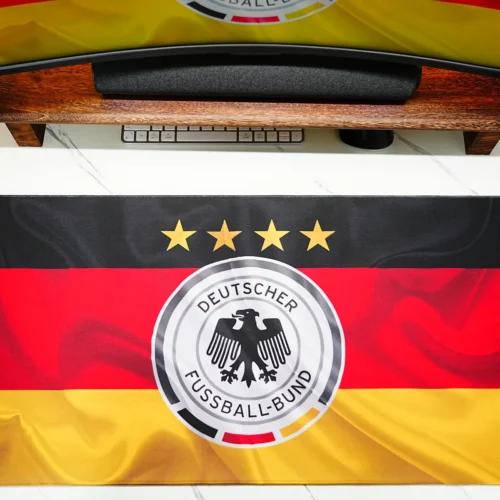 Germany football desk mat matched with a monitor wallpaper to create a unified football fan workspace