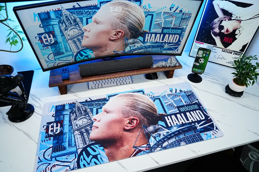 Haaland Man City Welcome Desk Mat displayed in a complete football-themed desk setup, turning an ordinary workspace into a Manchester City-inspired fan environment with coordinated artwork across the desk and monitor.