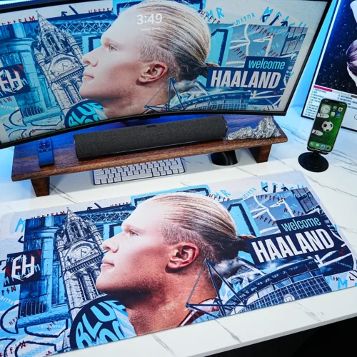 Haaland Man City Welcome Desk Mat displayed in a complete football-themed desk setup, turning an ordinary workspace into a Manchester City-inspired fan environment with coordinated artwork across the desk and monitor.