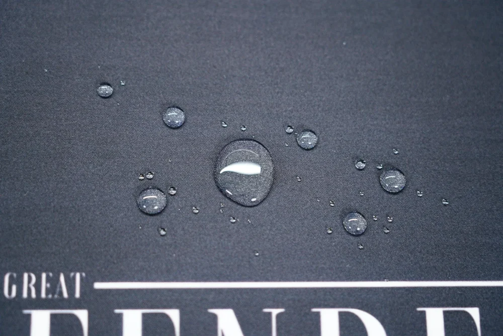 James Harden Desk Mat Spill Resistant Surface Water droplets bead on the James Harden desk mat surface to show spill-resistant fabric that helps protect the printed design