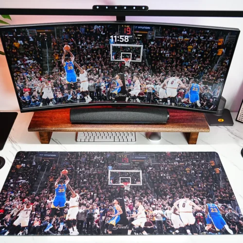 Warriors Finals basketball desk mat shown with a wide curved monitor, matching Durant wallpaper, and a clean fan desk setup