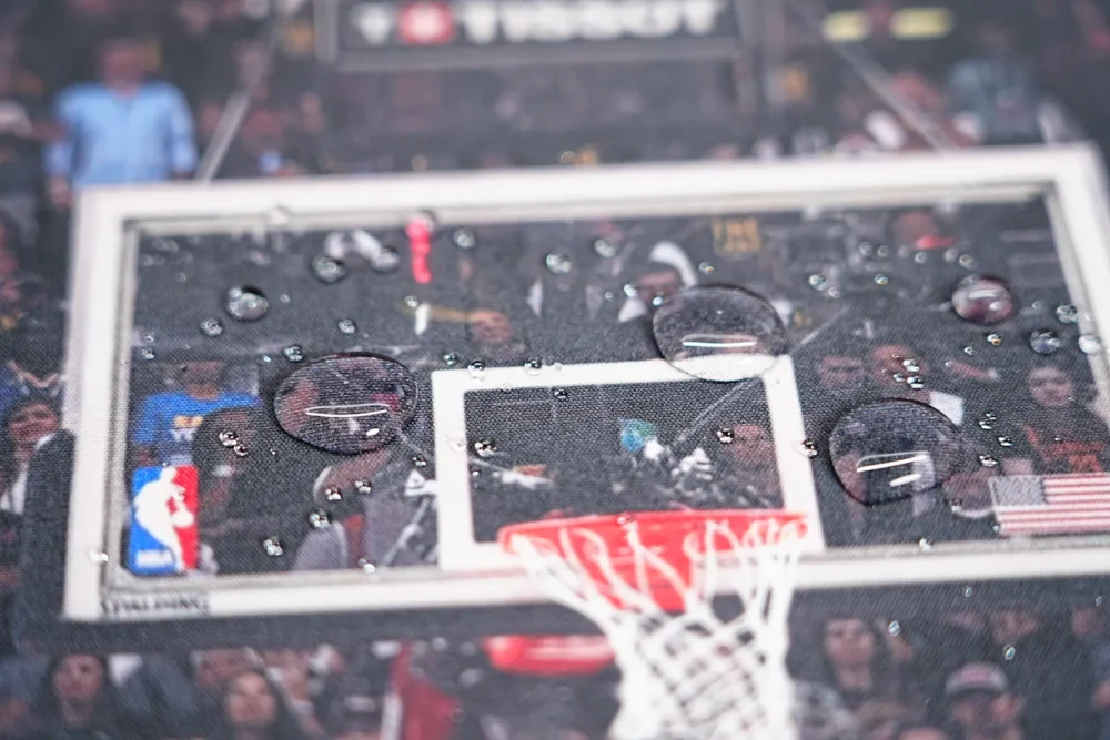 Spill resistant Kevin Durant basketball desk mat surface with water beads staying on the printed Finals court artwork