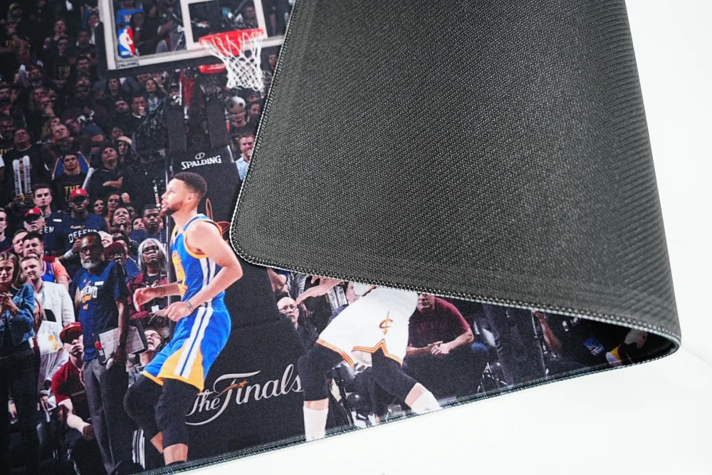 Anti slip rubber base and stitched edge shown on a Kevin Durant basketball desk mat for stable long-term desk use