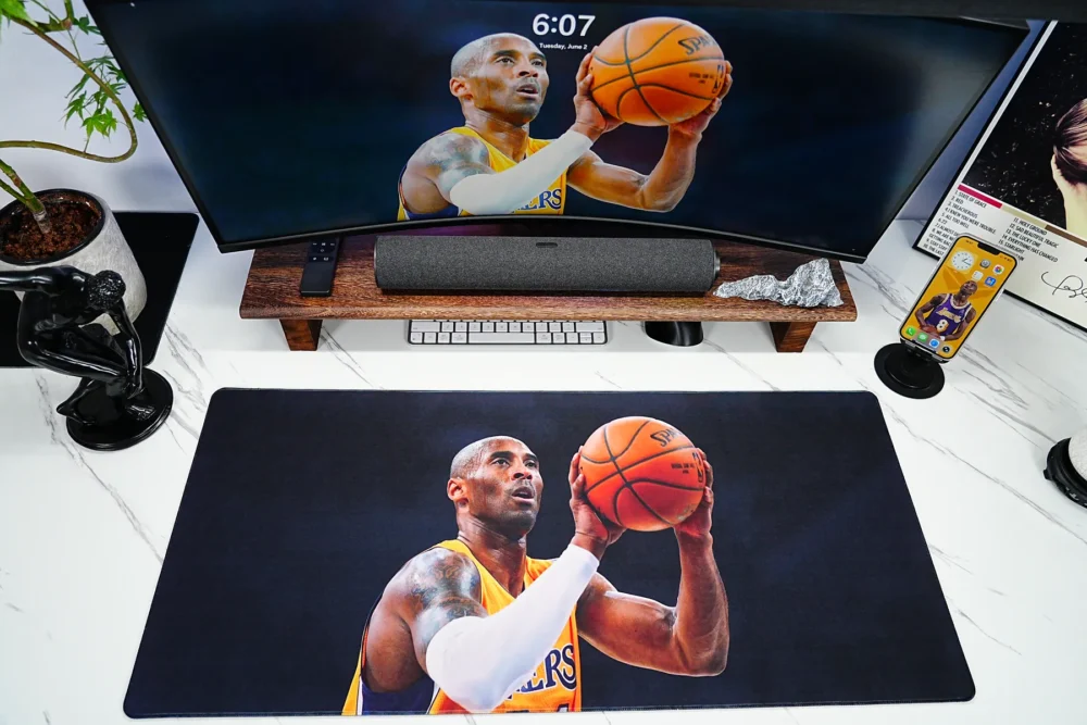 Kobe Bryant themed desk mat matched with monitor wallpaper and phone display for a unified fan setup