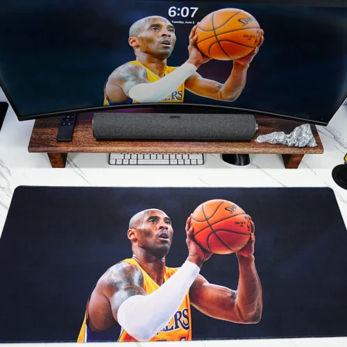 Kobe Bryant themed desk mat matched with monitor wallpaper and phone display for a unified fan setup