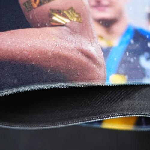 Mbappe mouse pad bent to show stitched edges, flexible surface, 4mm thickness, and textured anti-slip rubber base