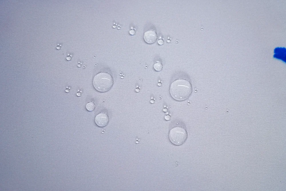 Spill-Resistant Basketball Mouse Pad Surface Water droplets resting on the basketball mouse pad surface, showing spill-resistant fabric that helps protect the print from daily splashes
